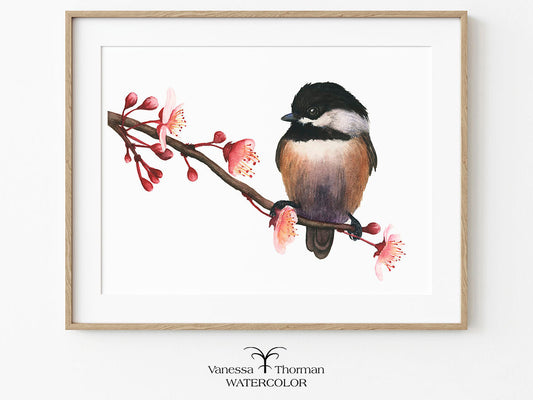Framed watercolor painting of a bird on a branch with flowers on a white background.