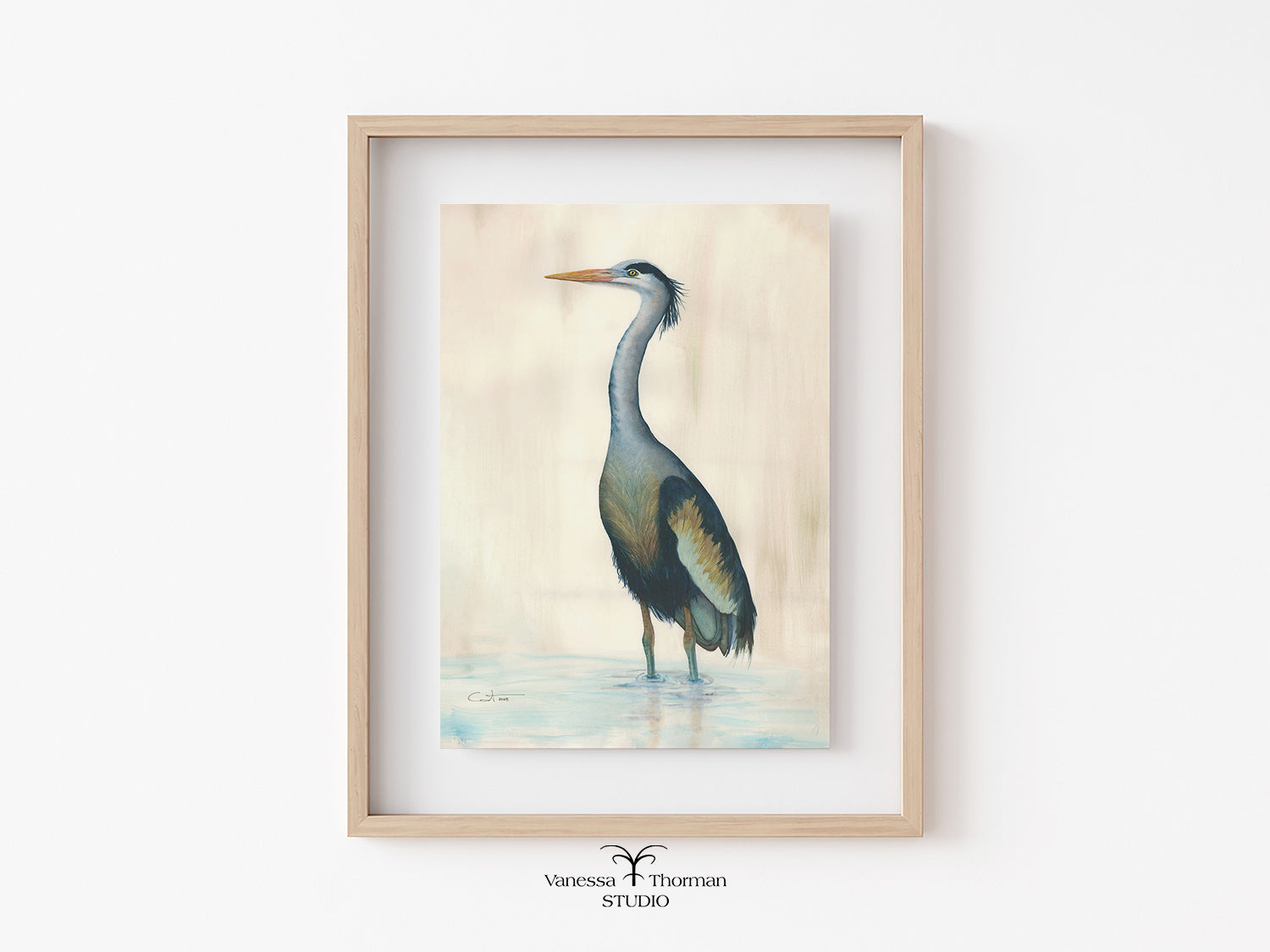 Framed artwork of a heron on a light background