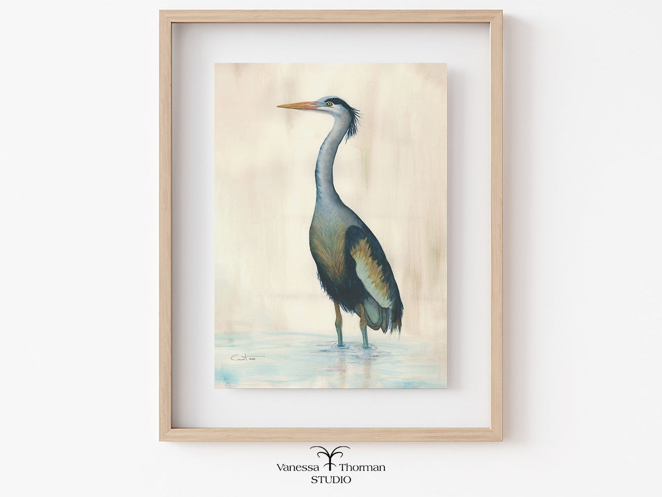 Framed artwork of a heron on a light background