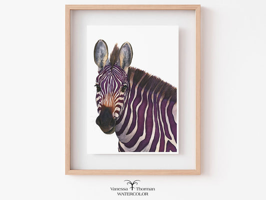 Framed artwork of a purple and white zebra on a white wall