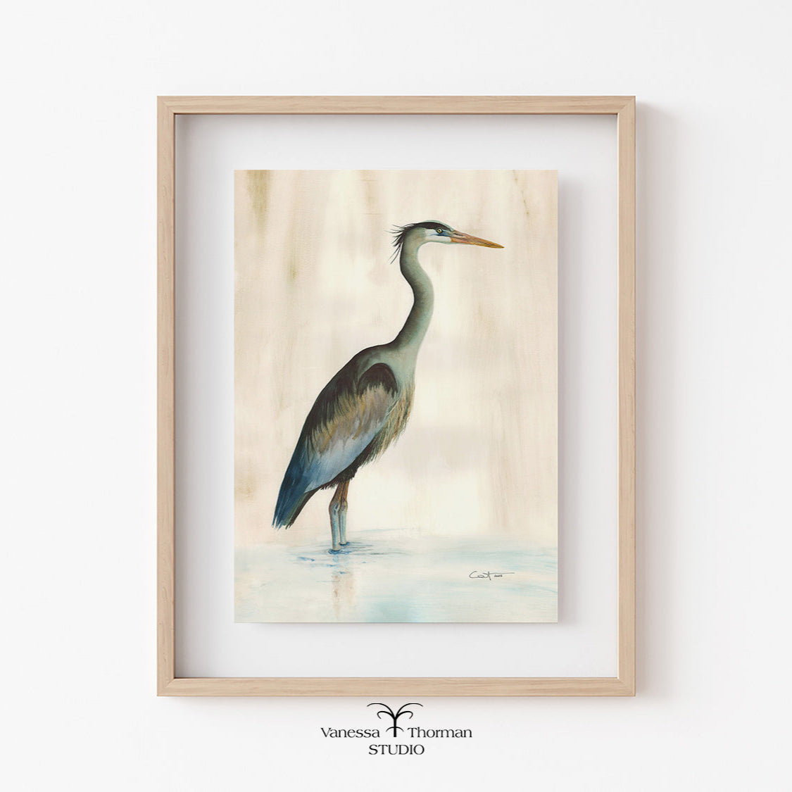 Framed artwork of a heron on a light background