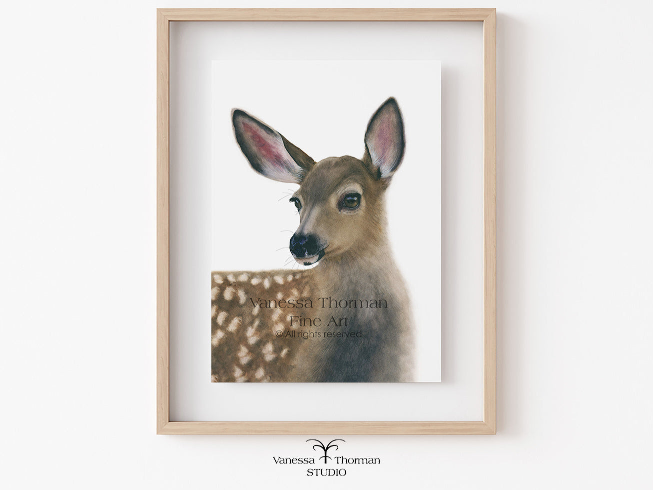 Framed artwork of a deer with a white background
